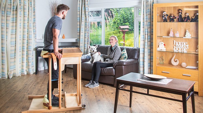 The Custom Oswestry Standing Frame standing frame being used in the home